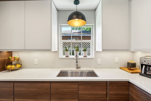 605 Cliffside Dr, Richardson, TX 75080 - kitchen with modern cabinets, a sink, white cabinets, and light countertops