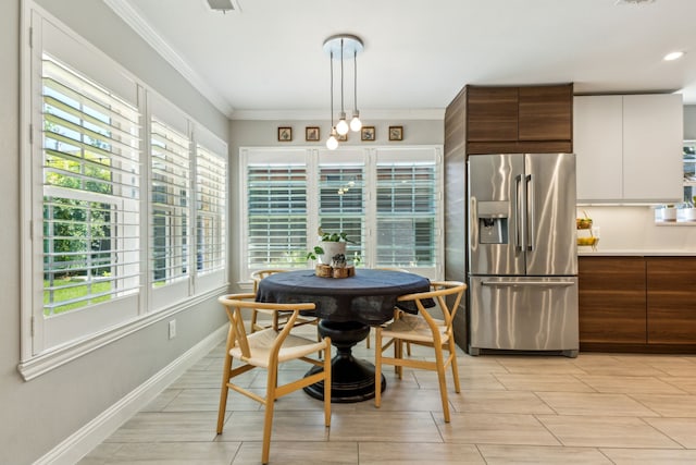 605 Cliffside Dr, Richardson, TX 75080 - dining space with ornamental molding, wood tiled floors, and baseboards