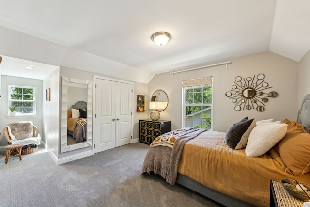 605 Cliffside Dr, Richardson, TX 75080 - carpeted bedroom with vaulted ceiling, multiple windows, and a closet