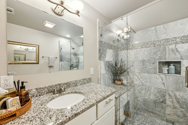 605 Cliffside Dr, Richardson, TX 75080 - bathroom featuring a shower stall, vanity, and a chandelier
