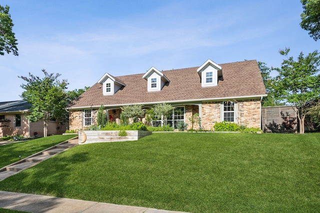 605 Cliffside Dr, Richardson, TX 75080 - new england style home with a front lawn, brick siding, and roof with shingles