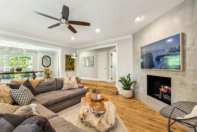 605 Cliffside Dr, Richardson, TX 75080 - living area featuring wood finished floors, a high end fireplace, ceiling fan, crown molding, and recessed lighting