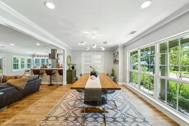 605 Cliffside Dr, Richardson, TX 75080 - dining room featuring light wood-style floors, crown molding, a chandelier, recessed lighting, and baseboards