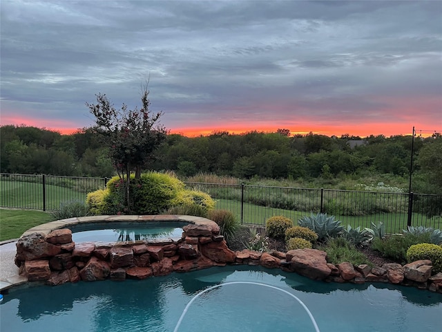 11667 Bent Creek Trl, Frisco, TX 75033 - pool at dusk with a jacuzzi