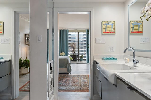 3310 Fairmount St Unit 16B, Dallas, TX 75201 - bathroom featuring vanity and wood finished floors