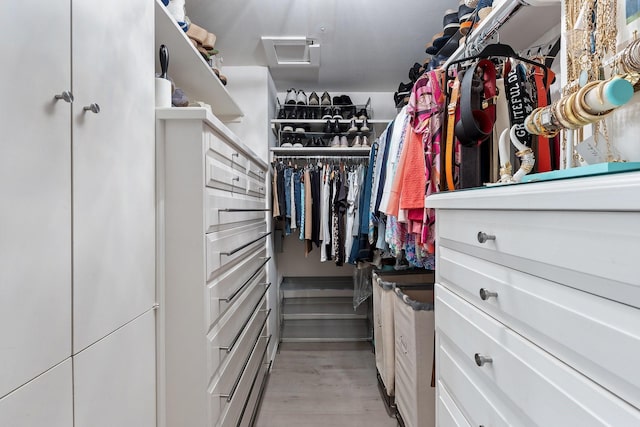 3310 Fairmount St Unit 16B, Dallas, TX 75201 - walk in closet with attic access and light wood-type flooring