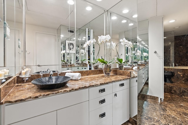 3310 Fairmount St Unit 16B, Dallas, TX 75201 - full bathroom featuring vanity, marble tiled floors, a shower, recessed lighting, and a bathtub