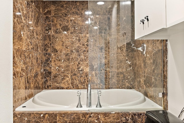 3310 Fairmount St Unit 16B, Dallas, TX 75201 - bathroom featuring tiled tub and a shower
