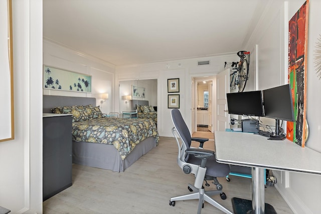 3310 Fairmount St Unit 16B, Dallas, TX 75201 - bedroom featuring ornamental molding, light wood-style floors, and an office area