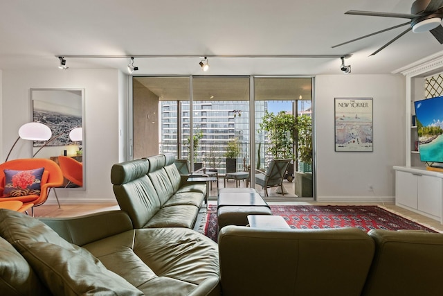3310 Fairmount St Unit 16B, Dallas, TX 75201 - living area featuring track lighting, a ceiling fan, plenty of natural light, and expansive windows
