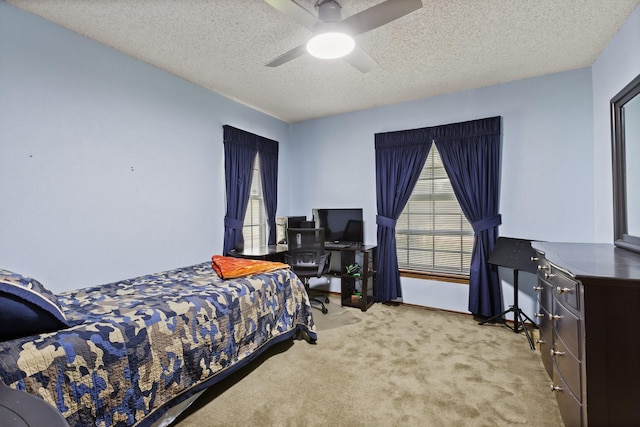 1720 Norwood Dr, Hurst, TX 76054 - carpeted bedroom featuring multiple windows, a textured ceiling, and ceiling fan