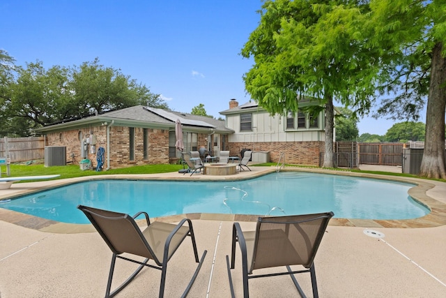 1720 Norwood Dr, Hurst, TX 76054 - view of pool featuring a patio, central AC, and a fenced backyard
