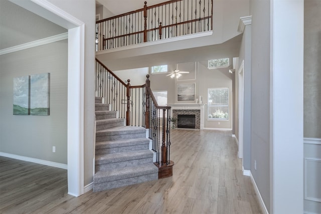 4109 Barnsley Dr, Plano, TX 75093 - foyer featuring a towering ceiling, ceiling fan, wood finished floors, plenty of natural light, and ornamental molding