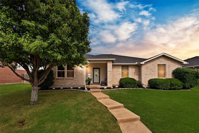 1819 Wildrose Dr, Rockwall, TX 75032 - view of front facade with brick siding and a yard