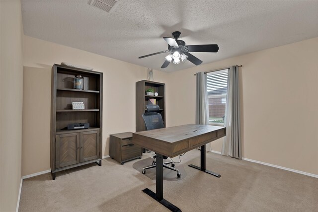1819 Wildrose Dr, Rockwall, TX 75032 - home office with light colored carpet, a ceiling fan, a textured ceiling, and baseboards