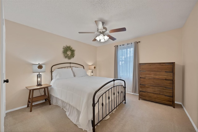 1819 Wildrose Dr, Rockwall, TX 75032 - bedroom featuring light colored carpet, baseboards, a ceiling fan, and a textured ceiling