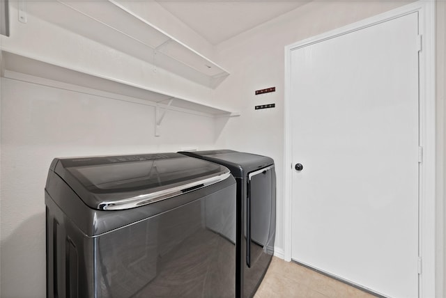 1819 Wildrose Dr, Rockwall, TX 75032 - laundry room with separate washer and dryer and light tile patterned floors