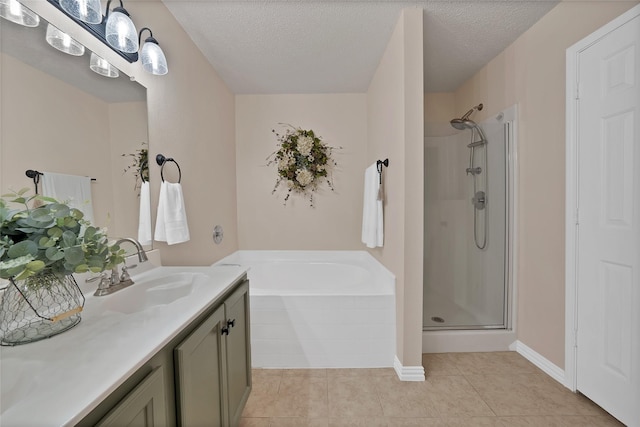 1819 Wildrose Dr, Rockwall, TX 75032 - full bath featuring a stall shower, a bath, vanity, tile patterned flooring, and a textured ceiling
