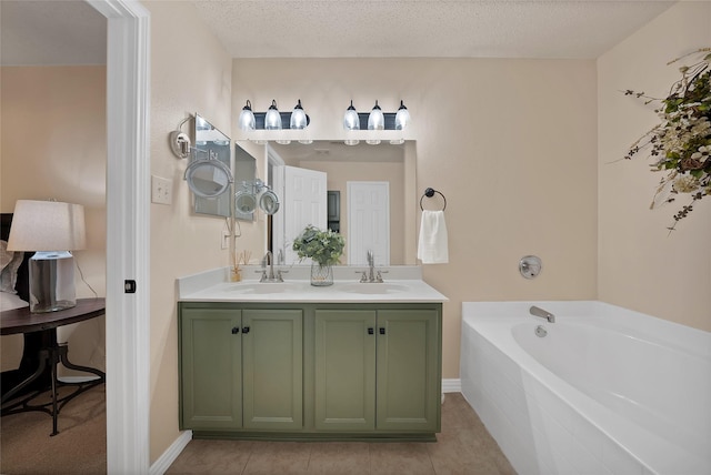 1819 Wildrose Dr, Rockwall, TX 75032 - bathroom featuring double vanity, a garden tub, tile patterned flooring, and baseboards