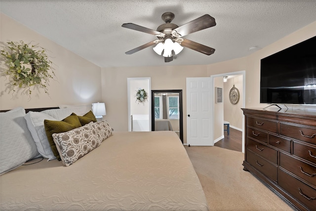 1819 Wildrose Dr, Rockwall, TX 75032 - bedroom featuring light colored carpet, ceiling fan, a textured ceiling, and baseboards