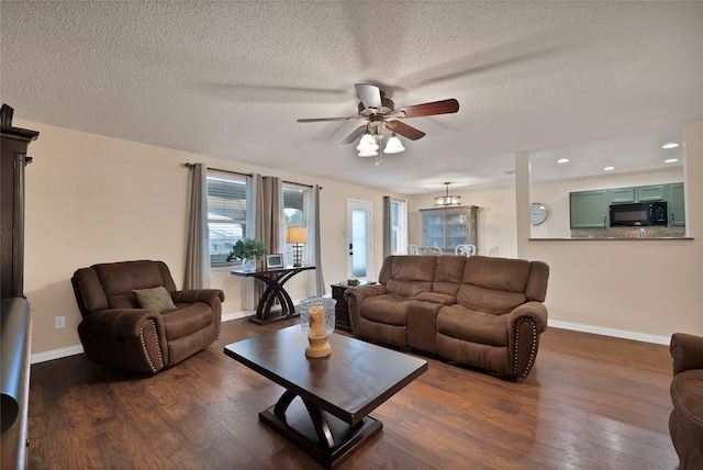 1819 Wildrose Dr, Rockwall, TX 75032 - living area with ceiling fan, dark wood-type flooring, baseboards, recessed lighting, and a textured ceiling