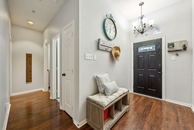 1629 Big Bend Dr, Lewisville, TX 75077 - entryway featuring a chandelier, dark wood finished floors, and baseboards