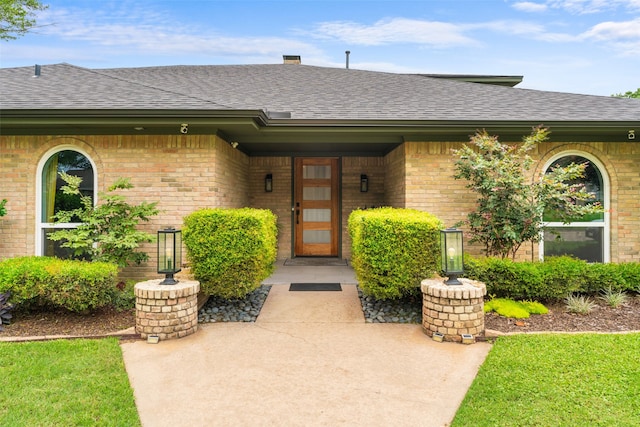 2909 N Britain Rd, Irving, TX 75062 - property entrance featuring roof with shingles and brick siding