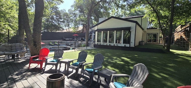 10823 Stone Canyon Rd, Dallas, TX 75230 - back of house featuring a wooden deck, a sunroom, and brick siding