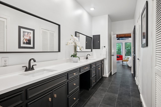 10823 Stone Canyon Rd, Dallas, TX 75230 - bathroom with a closet, double vanity, and tile patterned flooring