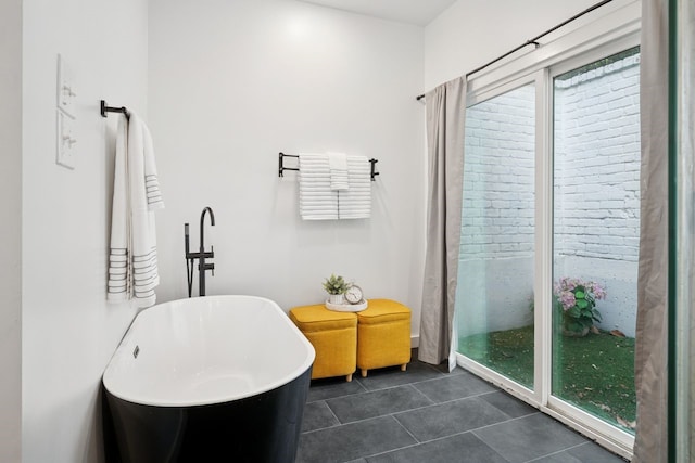 10823 Stone Canyon Rd, Dallas, TX 75230 - full bath featuring a freestanding tub and tile patterned flooring