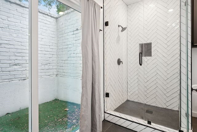10823 Stone Canyon Rd, Dallas, TX 75230 - full bathroom featuring a shower stall and tile patterned floors
