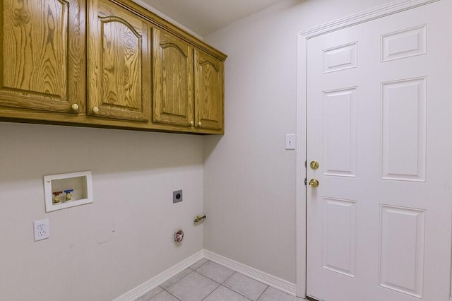 131 Crestridge Dr, Cedar Hill, TX 75104 - laundry room featuring cabinet space, electric dryer hookup, washer hookup, light tile patterned floors, and baseboards