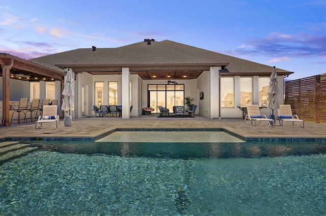 4728 Amble Way, Flower Mound, TX 75028 - back of house featuring ceiling fan, a patio area, an outdoor pool, stucco siding, and an outdoor living space
