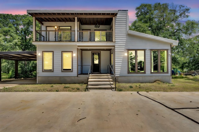 815 N Seven Points Dr, Kemp, TX 75143 - view of front of house with a balcony, a porch, and an attached carport