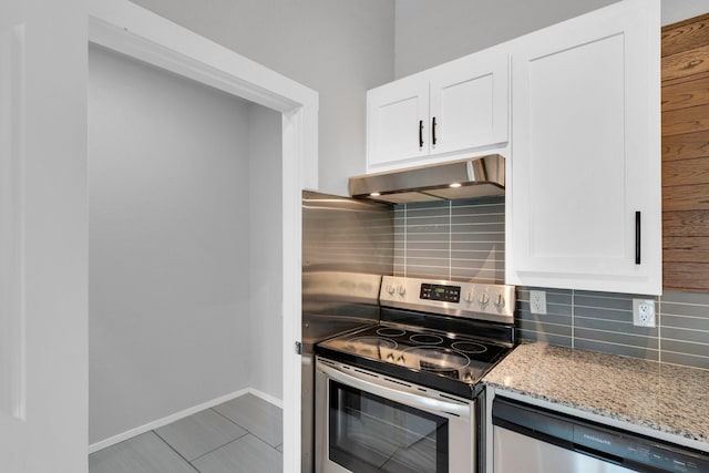 815 N Seven Points Dr, Kemp, TX 75143 - kitchen featuring under cabinet range hood, appliances with stainless steel finishes, light stone counters, tasteful backsplash, and white cabinetry