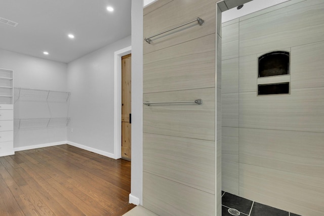 815 N Seven Points Dr, Kemp, TX 75143 - full bathroom with baseboards, recessed lighting, wood finished floors, and a tile shower