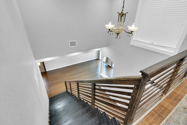 815 N Seven Points Dr, Kemp, TX 75143 - stairs featuring wood finished floors and a chandelier