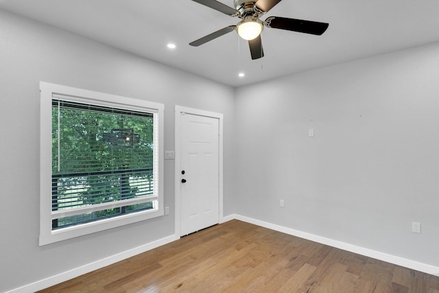 815 N Seven Points Dr, Kemp, TX 75143 - unfurnished room featuring wood finished floors, baseboards, a ceiling fan, and recessed lighting