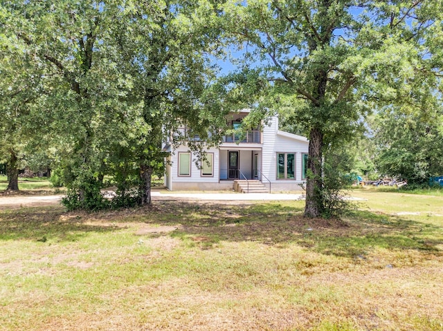 815 N Seven Points Dr, Kemp, TX 75143 - rear view of house featuring a balcony and a yard