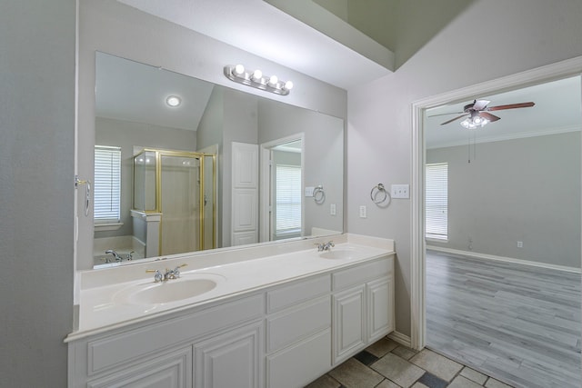6937 Andress Dr, Fort Worth, TX 76132 - bathroom featuring a stall shower, double vanity, ceiling fan, plenty of natural light, and crown molding