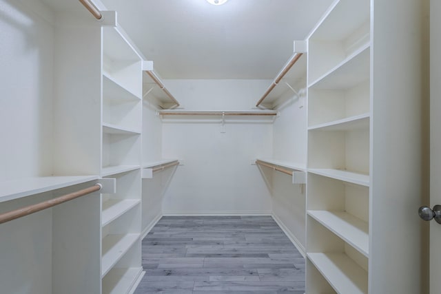 6937 Andress Dr, Fort Worth, TX 76132 - spacious closet with wood finished floors