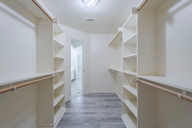 6937 Andress Dr, Fort Worth, TX 76132 - spacious closet with wood finished floors