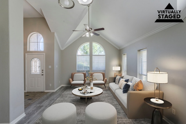6937 Andress Dr, Fort Worth, TX 76132 - living room with wood finished floors, ceiling fan, baseboards, lofted ceiling, and crown molding