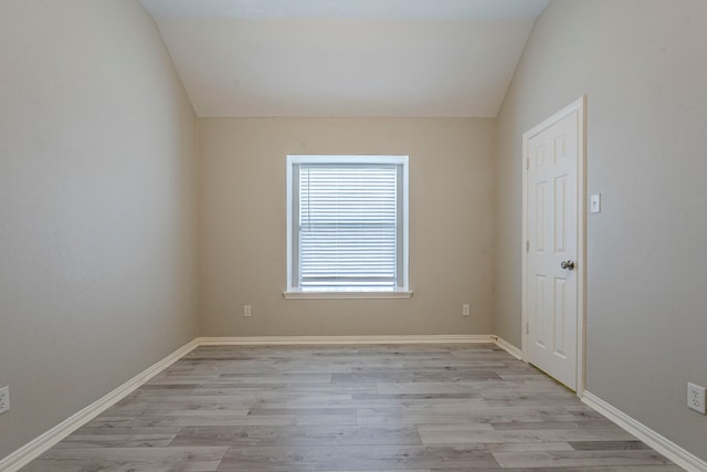 6937 Andress Dr, Fort Worth, TX 76132 - empty room with lofted ceiling, light wood-style flooring, and baseboards