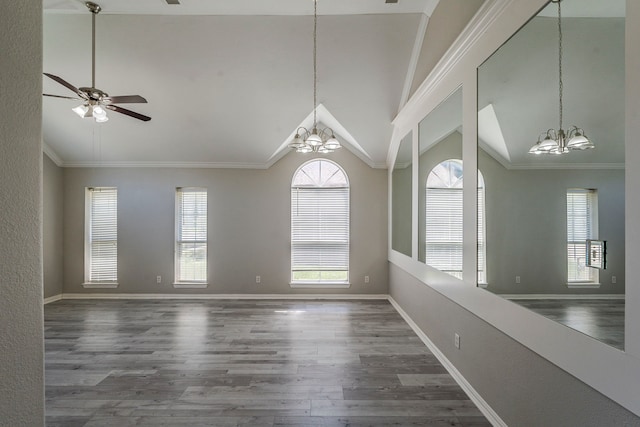 6937 Andress Dr, Fort Worth, TX 76132 - unfurnished room featuring a chandelier, wood finished floors, vaulted ceiling, plenty of natural light, and baseboards
