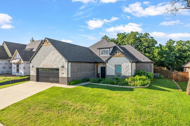 184 Lakeview Cir, Pilot Point, TX 76258 - french provincial home with stone siding, an attached garage, concrete driveway, a shingled roof, and brick siding