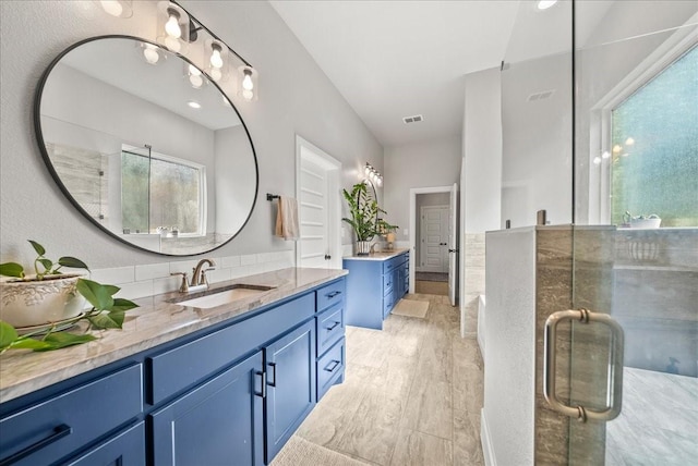 184 Lakeview Cir, Pilot Point, TX 76258 - bathroom featuring two vanities and a stall shower