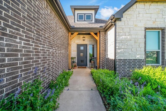 184 Lakeview Cir, Pilot Point, TX 76258 - view of exterior entry featuring brick siding