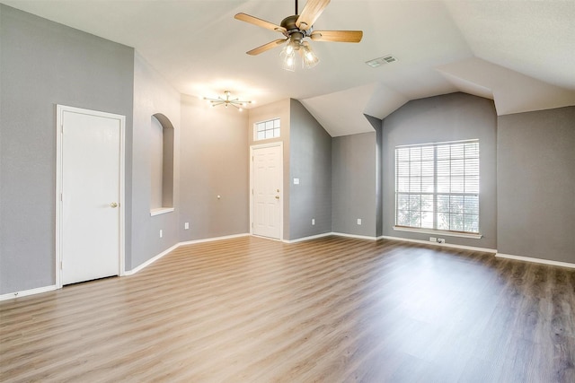 9805 Rockledge Rd, Fort Worth, TX 76108 - unfurnished living room featuring wood finished floors, a ceiling fan, baseboards, arched walkways, and lofted ceiling