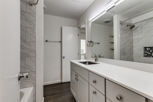 8601 Park Ln Unit 111, Dallas, TX 75231 - full bath featuring vanity, wood finished floors, shower / bathtub combination, and baseboards